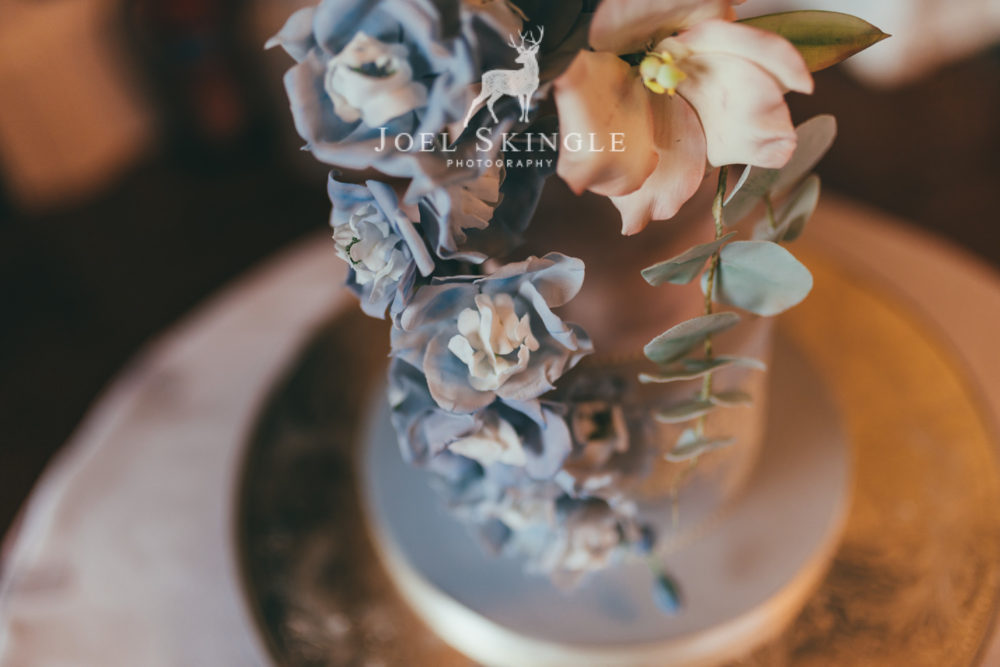 blush and blue wedding cake close up