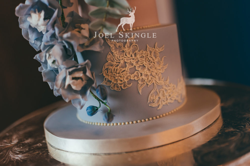 Close up hand piped lace wedding cake