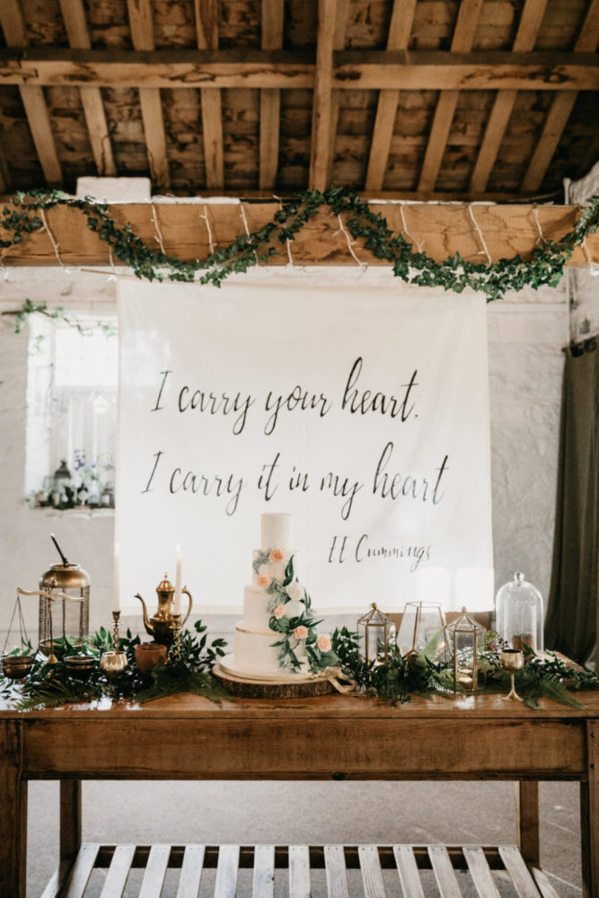 Boho green gold wedding cake display