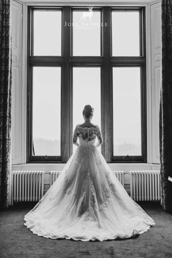 Nearlywed in wedding dress captured from behind