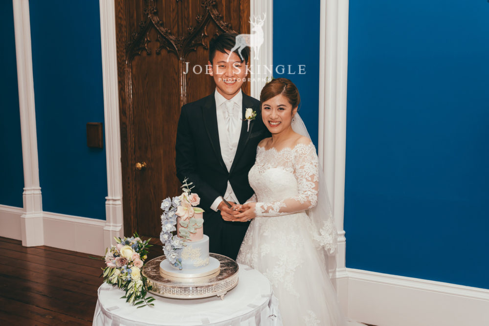 Newlyweds about to cut their cake