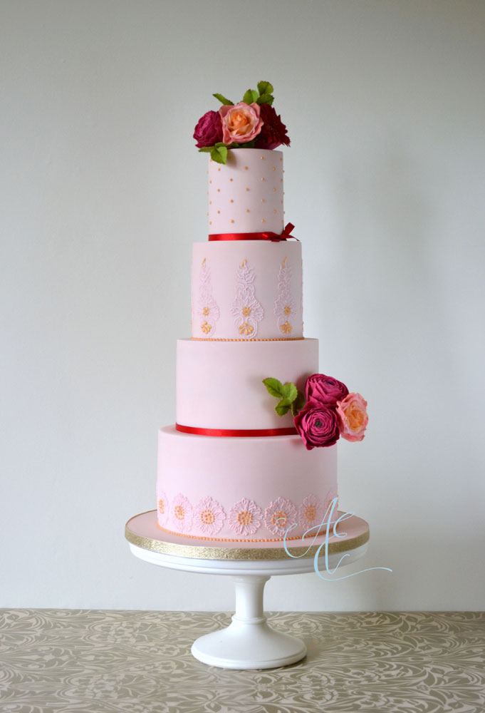 wedding cake with vibrant sugar flowers