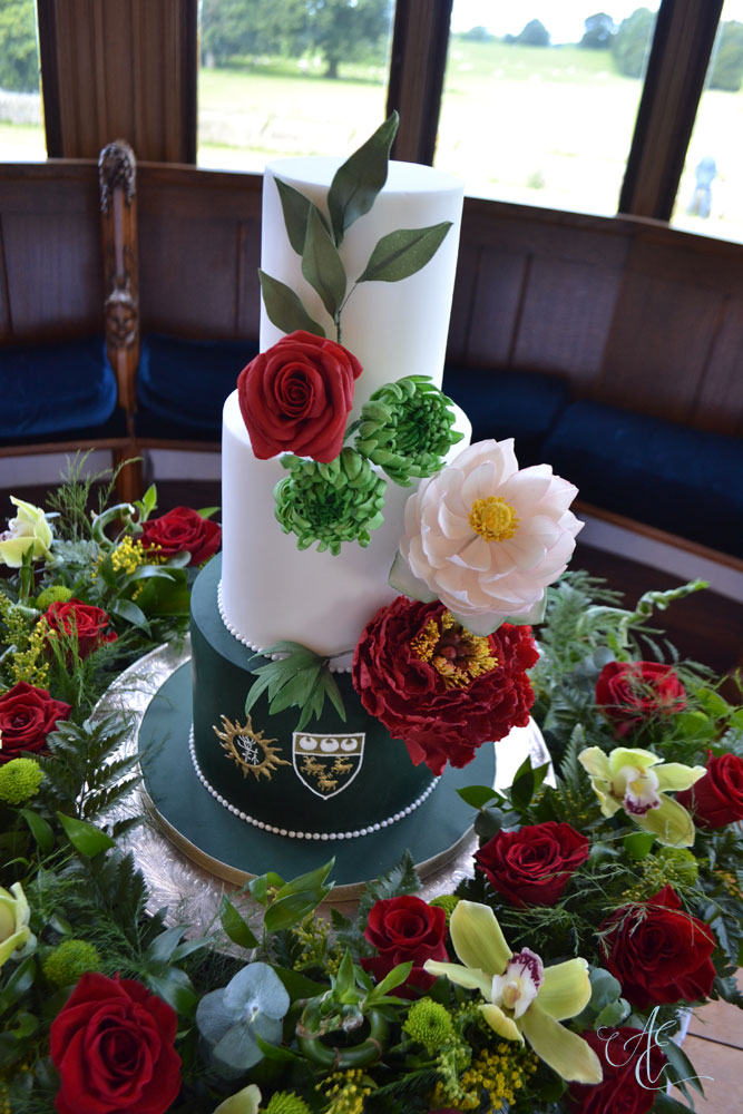 vibrant green red and gold floral wedding cake