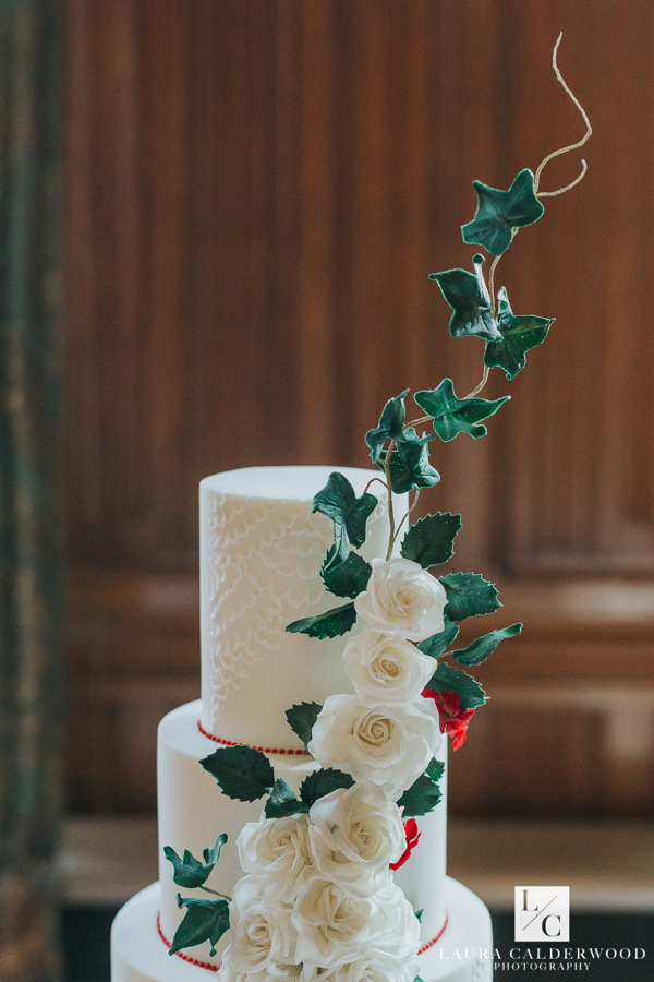 close up white rose cascade and ivy wedding cake 
