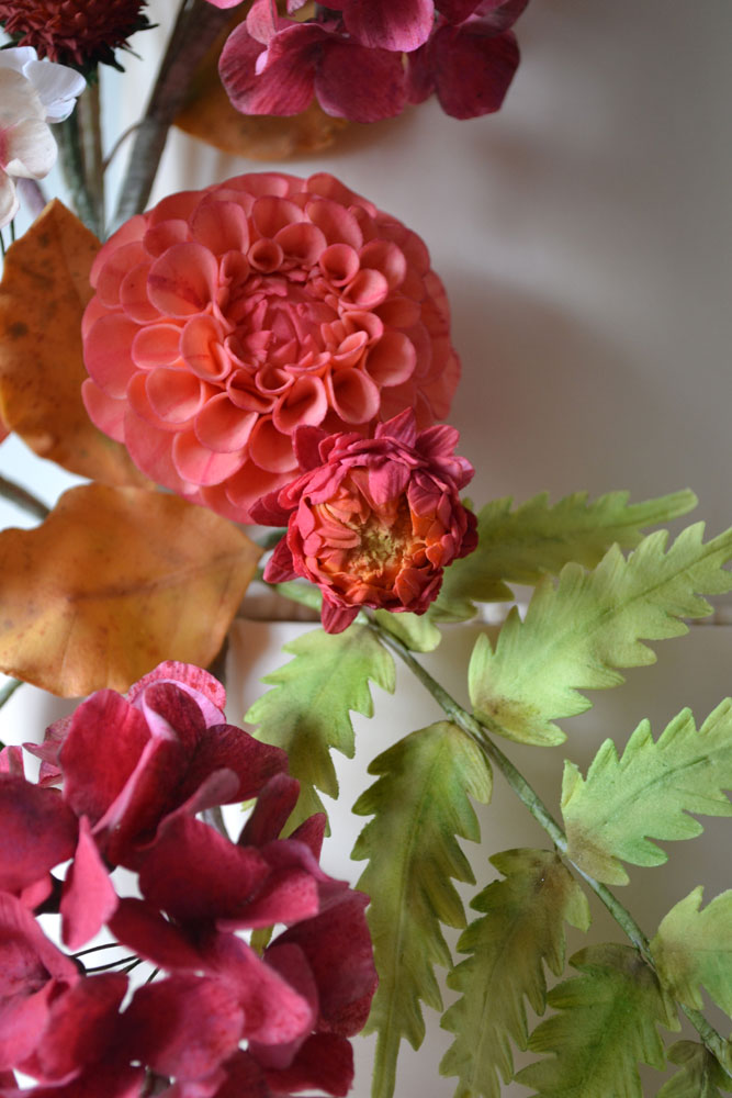 close up vibrant sugar dahlia and strawflower