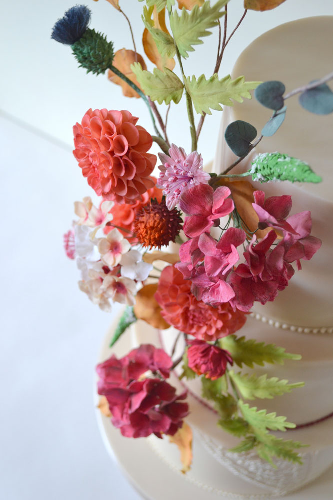 vibrant sugar floral wedding cake