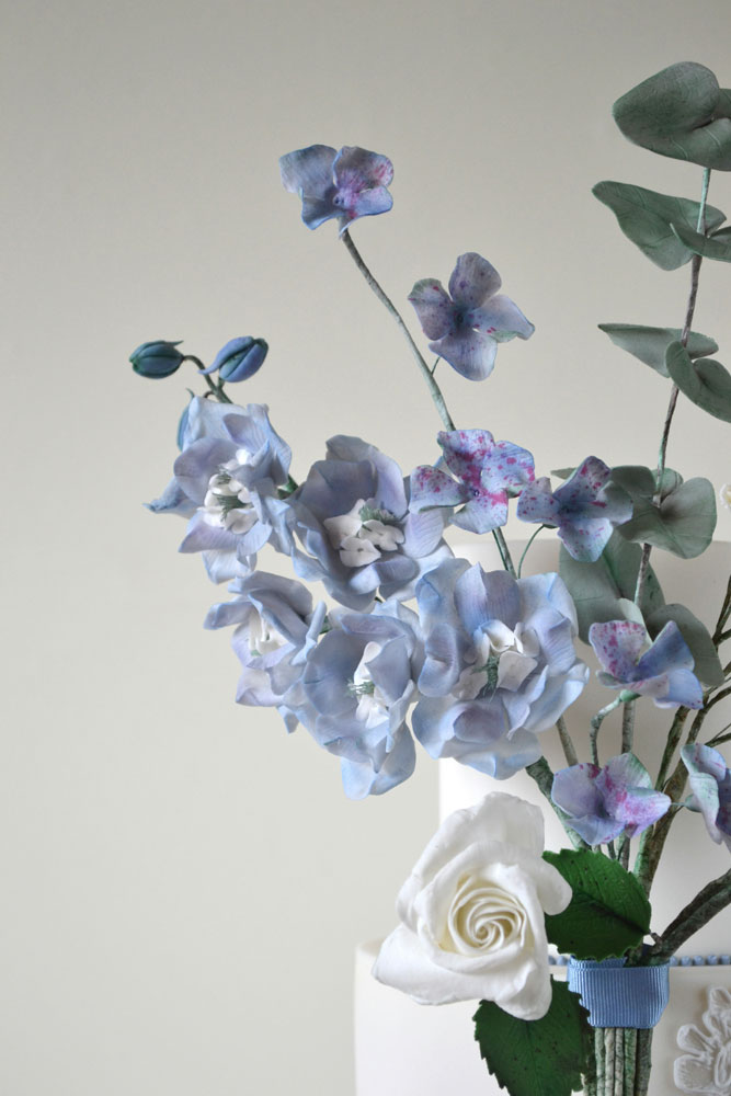 sugar blue delphiniums hydrangea white rose