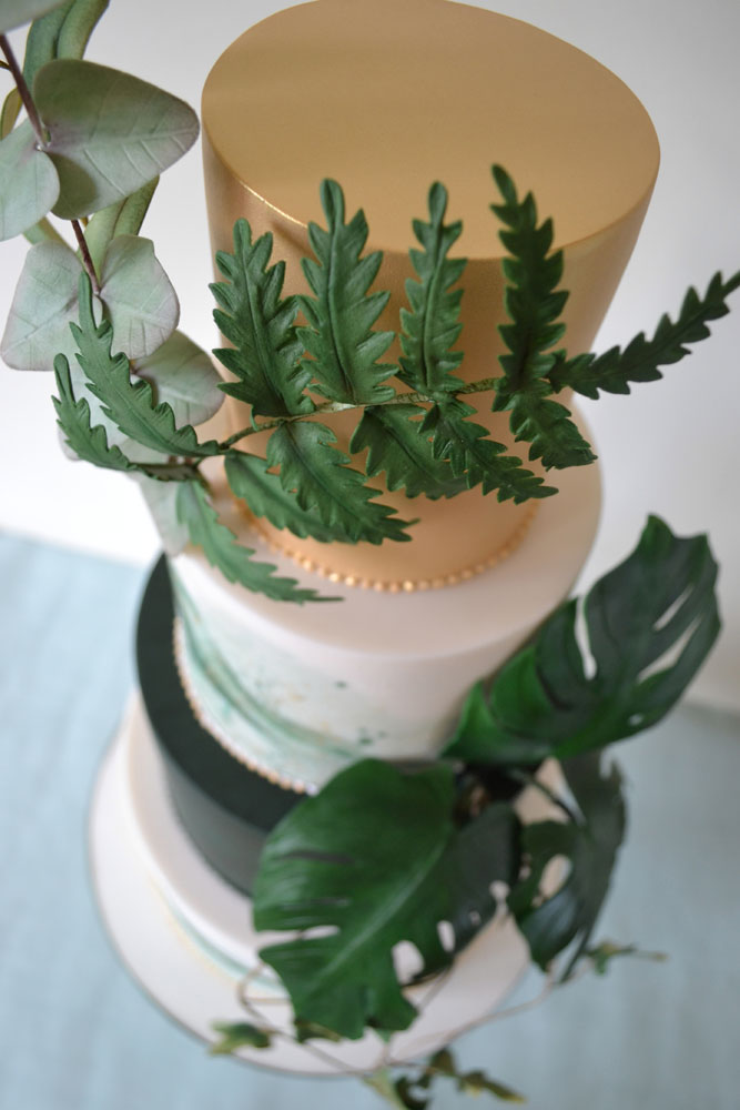 green gold foliage wedding cake aerial shot