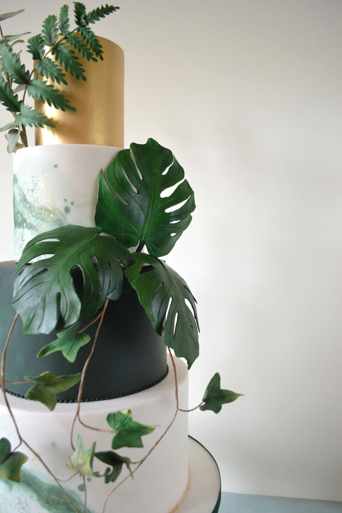 green sugar monstera and ivy wedding cake