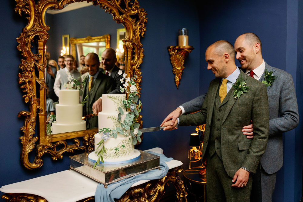 Newlyweds cutting their wedding cake