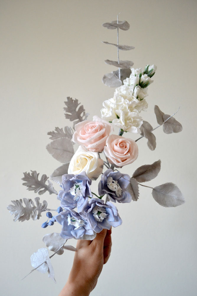 arrangement of sugar delphiniums, roses, stocks and foliage