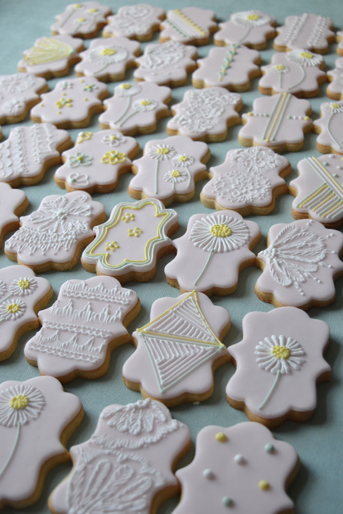 Baby shower pink and piped iced biscuit favours