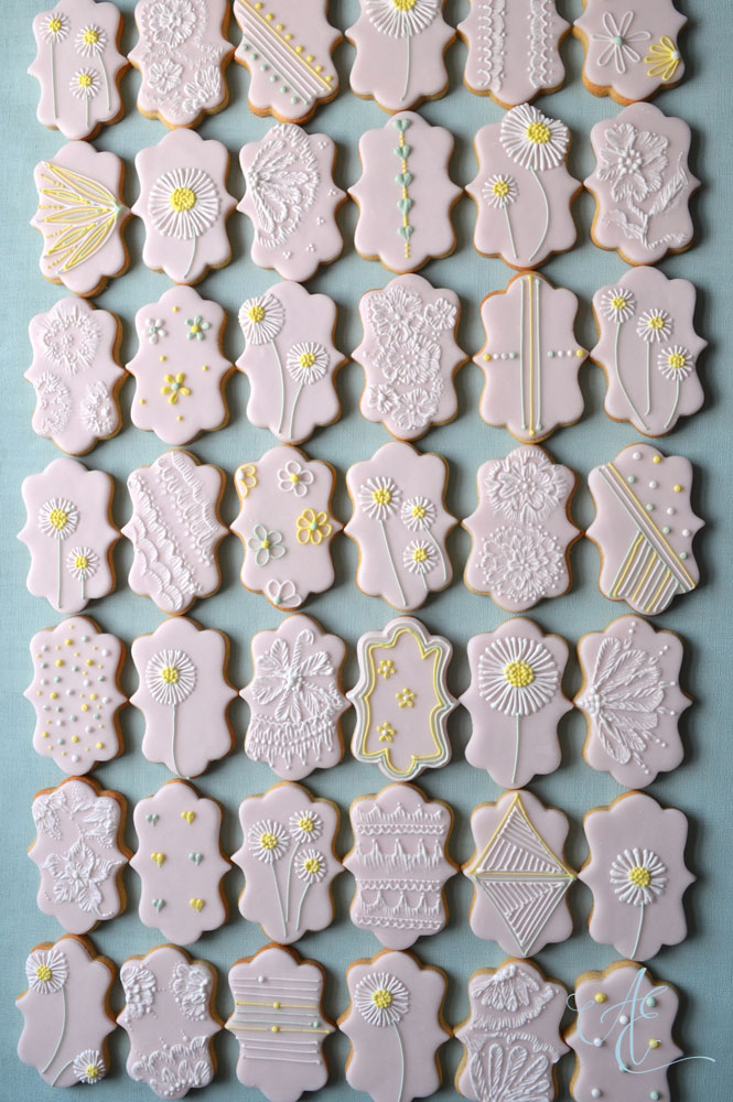 Pretty pink daisy and lace iced biscuit favours